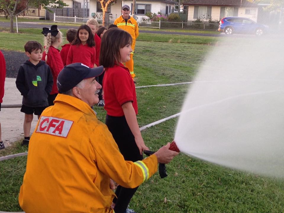 CFA members showing local students how the equipment is used