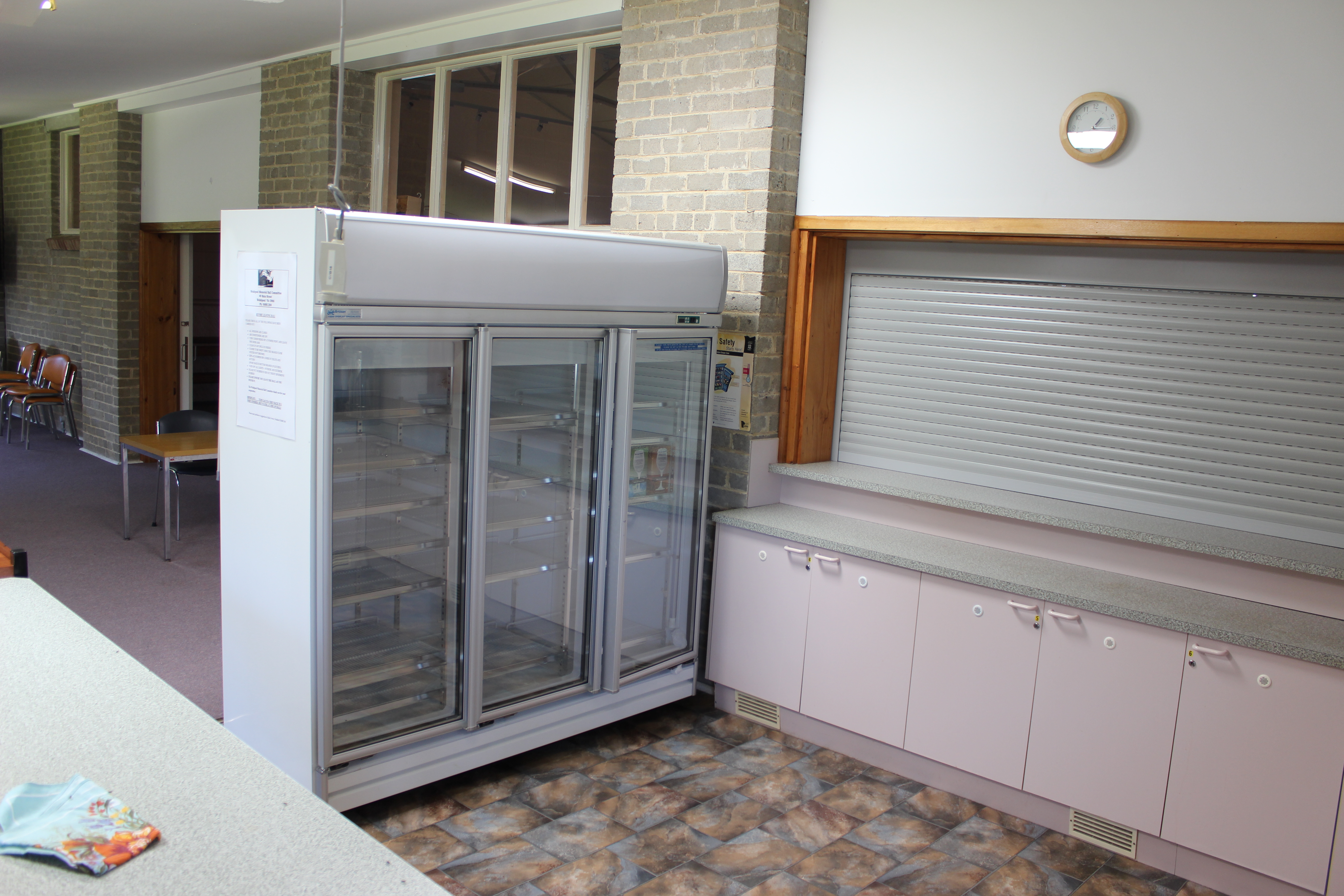 Side kitchen window access to main hall area